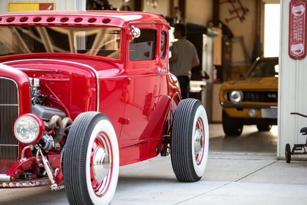 Antique red car in a garage