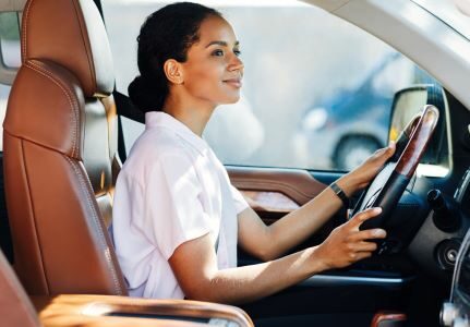 A woman driving a car.