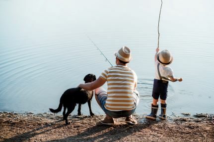 A family fishing on a lake.