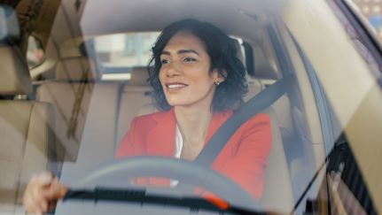 A woman driving a car.