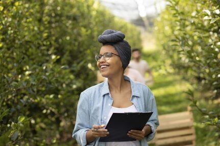 A woman holding a clipboard.