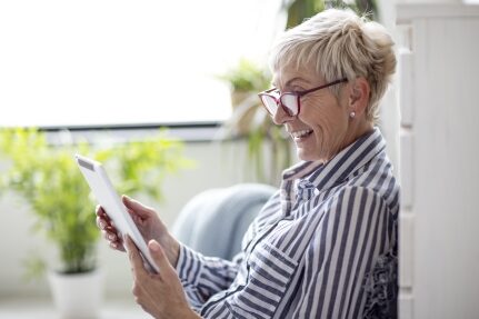 A woman shopping on her tablet.