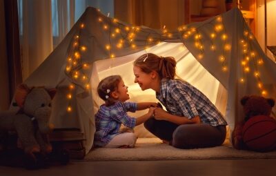 A mother and child in a tent.
