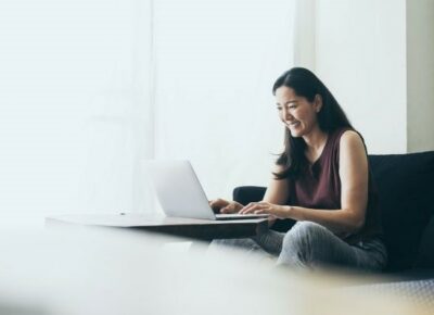 A woman using a laptop.