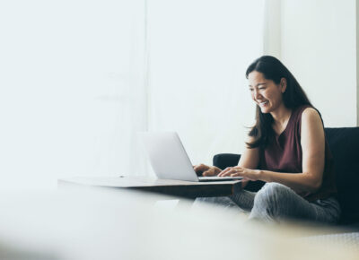 A woman works on a laptop.