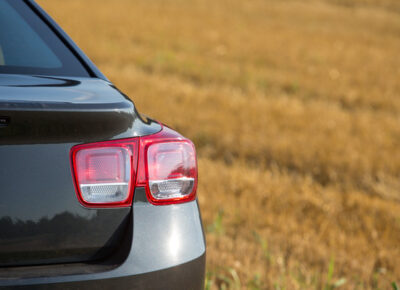 A rearview of a parked car.