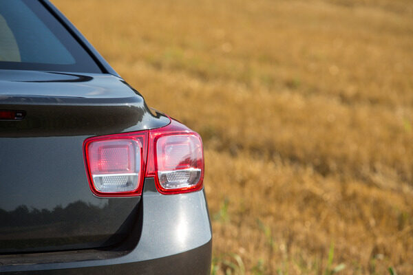 A rearview of a parked car.