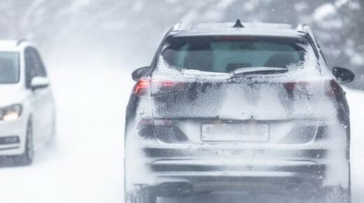 SUV on snow-covered road.