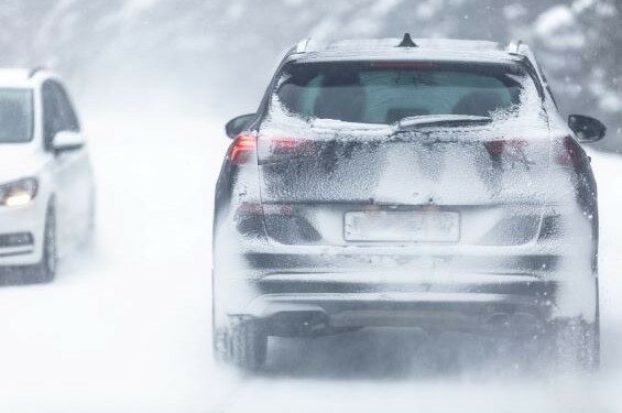 SUV on snow-covered road.