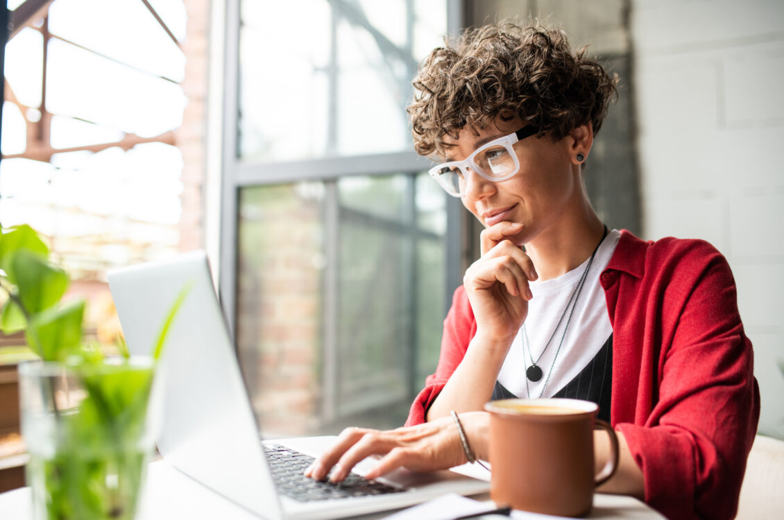 Woman works on a laptop.