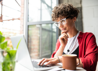 Woman works on a laptop.