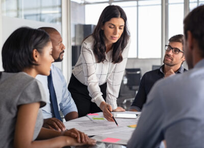 A group of people go over a business plan.