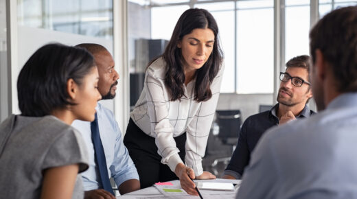 A group of people go over a business plan.