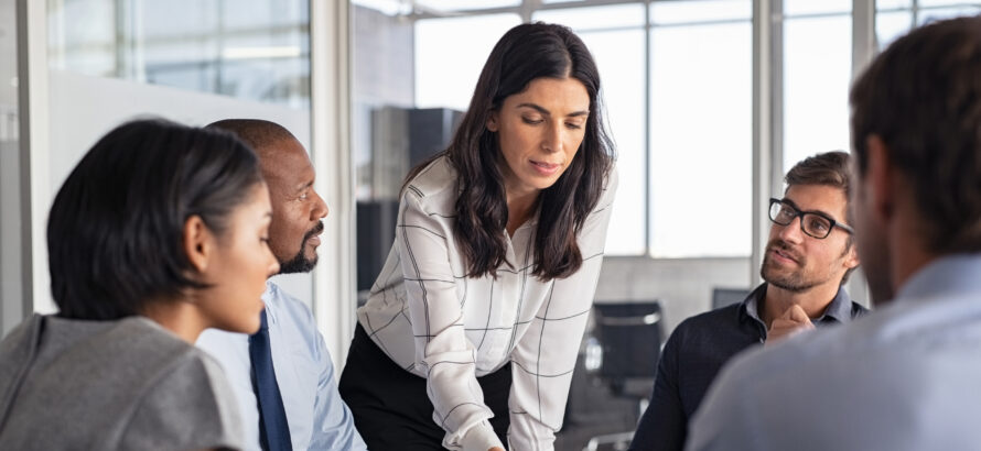 A group of people go over a business plan.