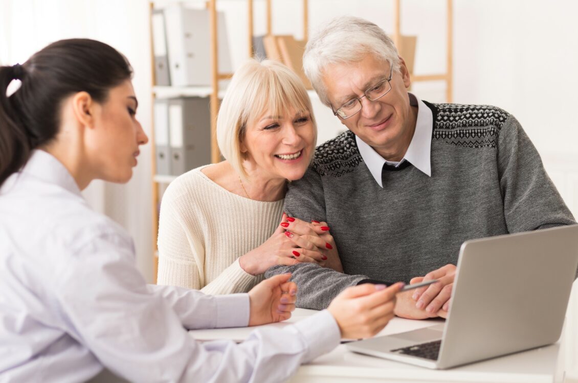 An older couple estate plan with a financial planner.