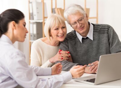 An older couple estate plan with a financial planner.