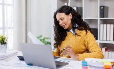 A woman takes time to do tax planning.