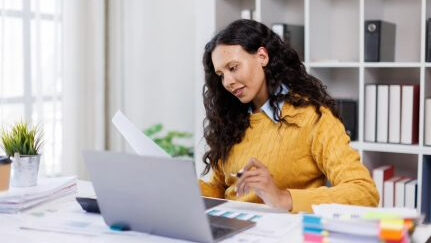 A woman takes time to do tax planning.